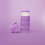 Load image into Gallery viewer, NöZ purple sunscreen standing vertical with the cap off to the left side

